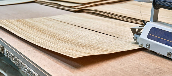 cutting real oak veneer to the furniture panels