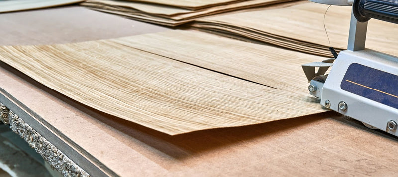cutting real oak veneer to the furniture panels