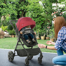 Red Foldable Baby Stroller with Reclining Backrest and Adjustable Canopy